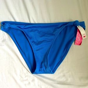 Tied at the end blue bathing suit bottoms.